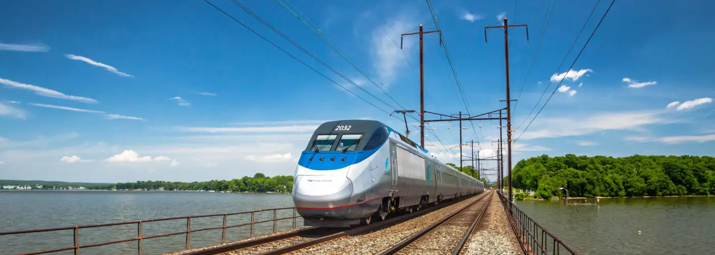 Amtrak train running on tracks over water