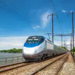 Amtrak train running on tracks over water