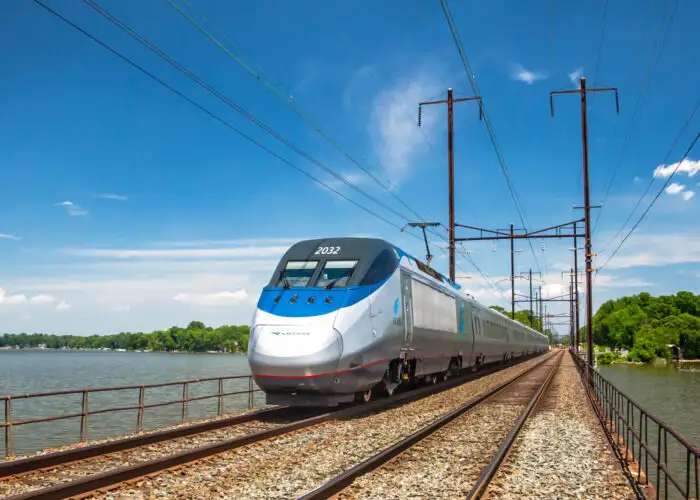 Amtrak train running on tracks over water