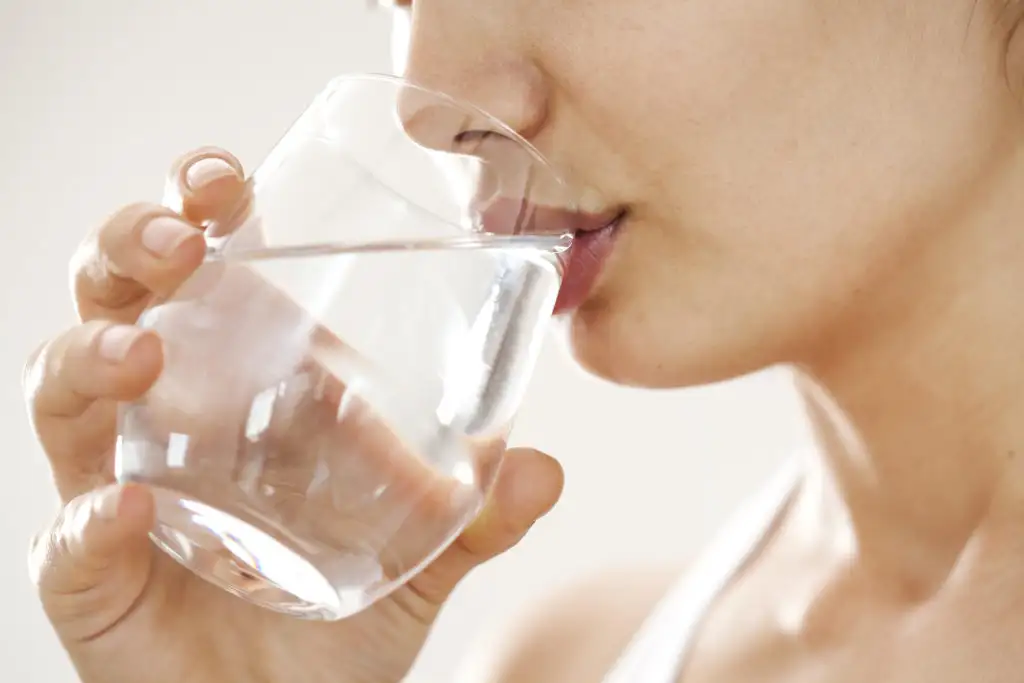 Woman drinking from a glass of water