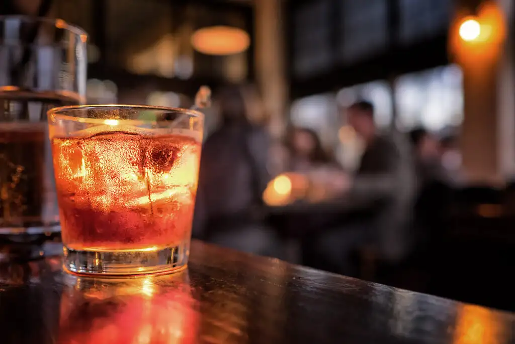 Close up on an unattended drink on a bar