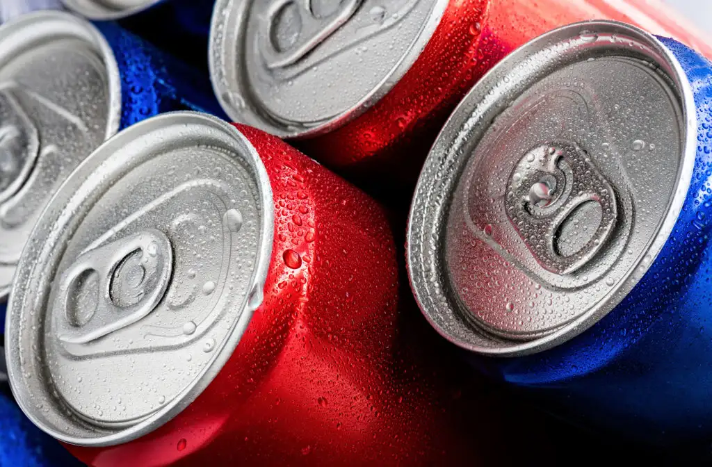 Red and blue cans of soft drinks