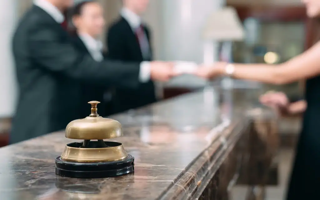 Guests checking in at hotel counter