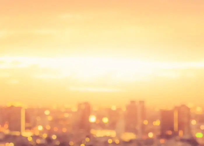 Hazy skyline of a city at sunset