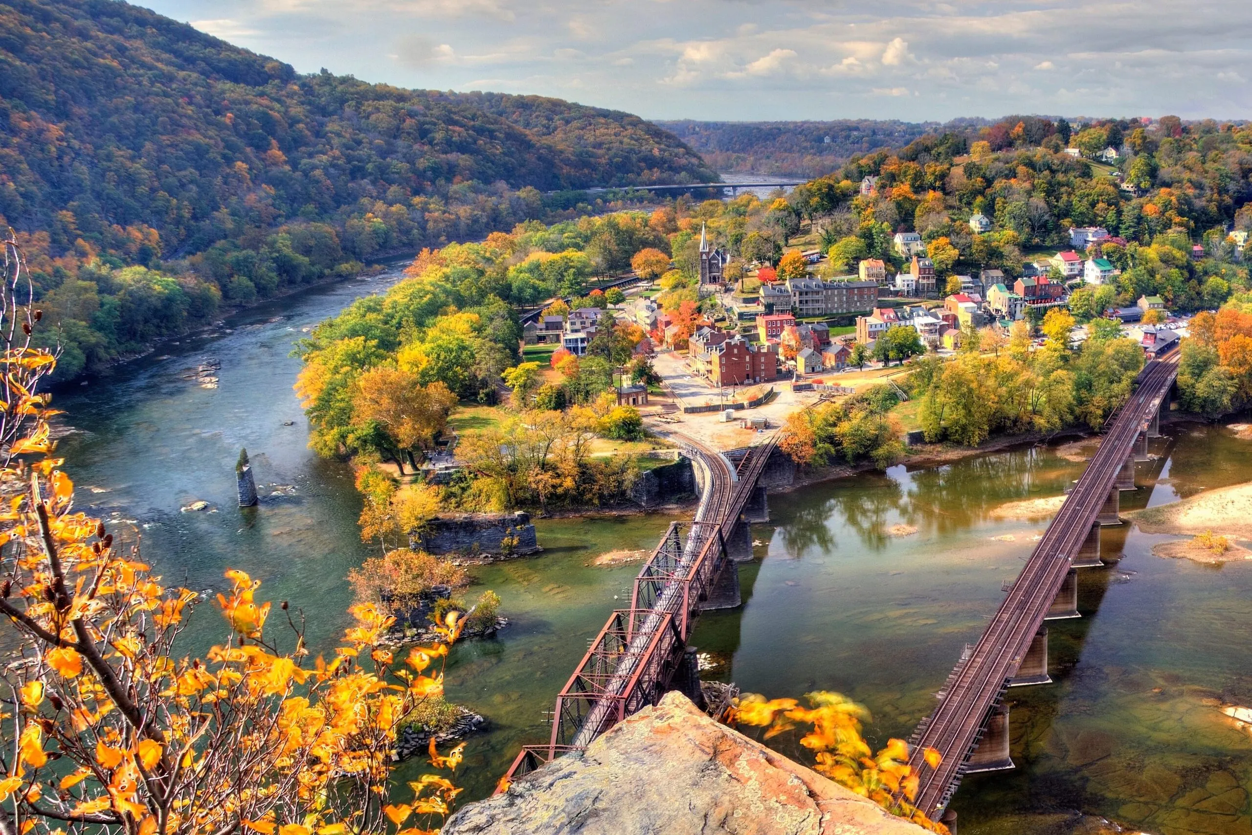 Aerial view of town at Harpers Ferry National Historical Park, Maryland, Virginia, and West Virginia surrounded by fall foliage