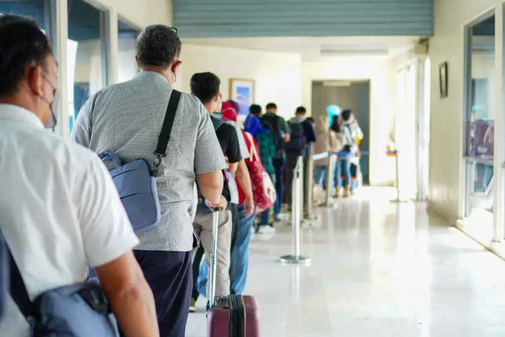 People waiting in line to board a flight