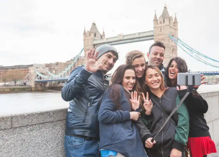 Group of friends taking a selfie in front of the Tower of London