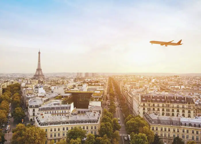 airplane flying over eiffel tower in paris france