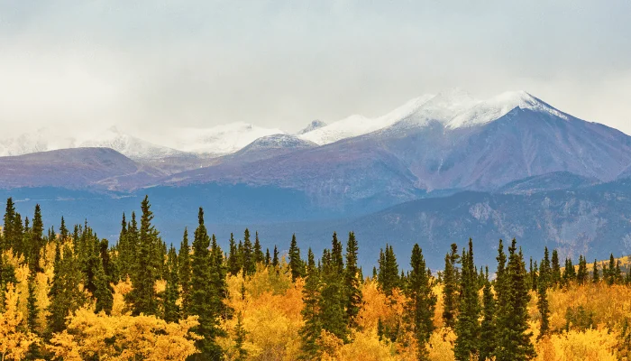 Alaska mountains landscape nature background in autumn fall season. Snow peaks banner panorama