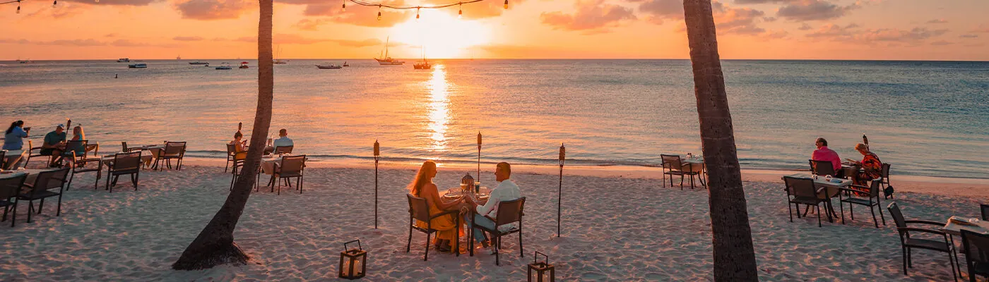 Couples on the beach a sunset