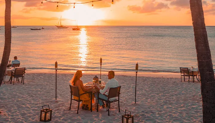 Couples on the beach a sunset