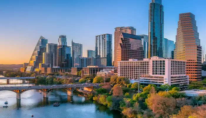 Austin, Texas- Panoramic cityscape and Colorado River against the sunset sky