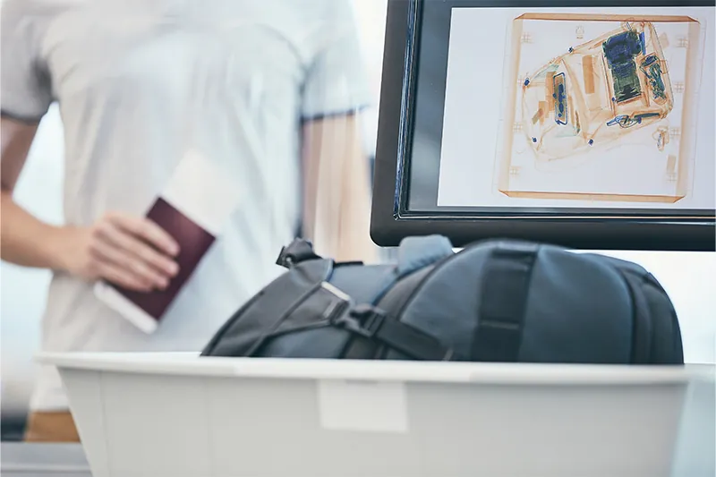 Close up of personal item being scanned at airport security