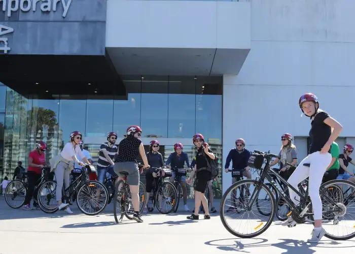 Group of cyclists wearing helmets.