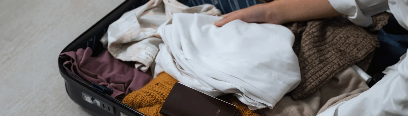 Close up of woman packing bags