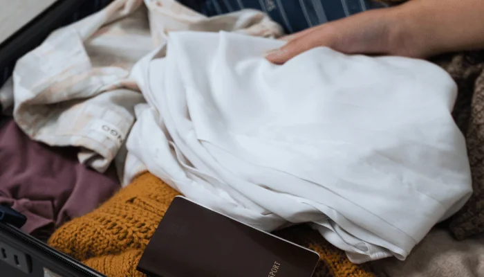 Close up of woman packing bags