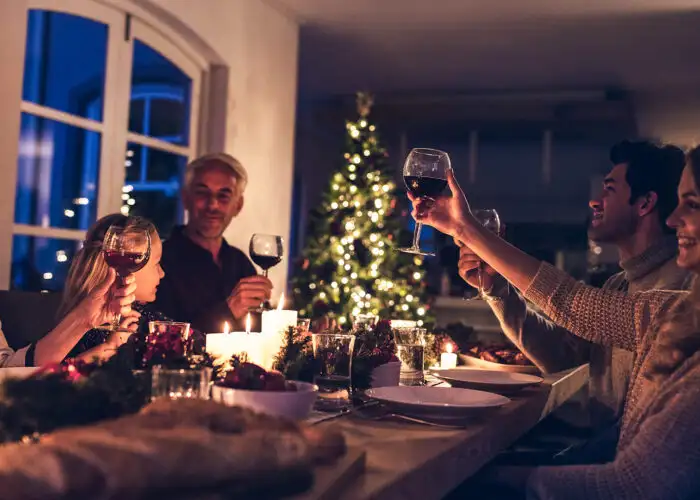 extended family toasting holiday dinner