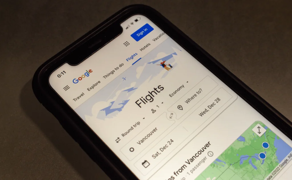 Google Flights website on iPhone screen