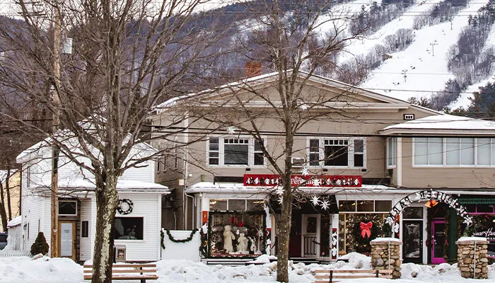 Church and store fronts with Cranmore Mountain Resort in the background