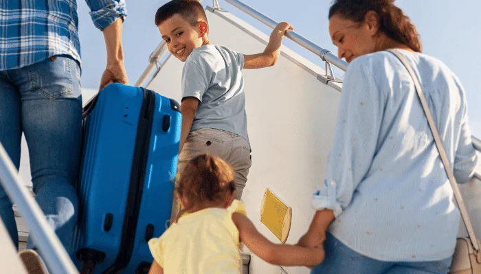 Header Image - Family boarding a plane, ready for vacation.