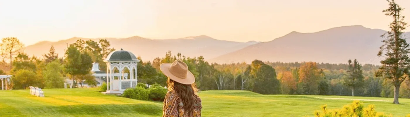 Woman with hat looking out over the grounds of the Mountain View Grand Resort and Spa