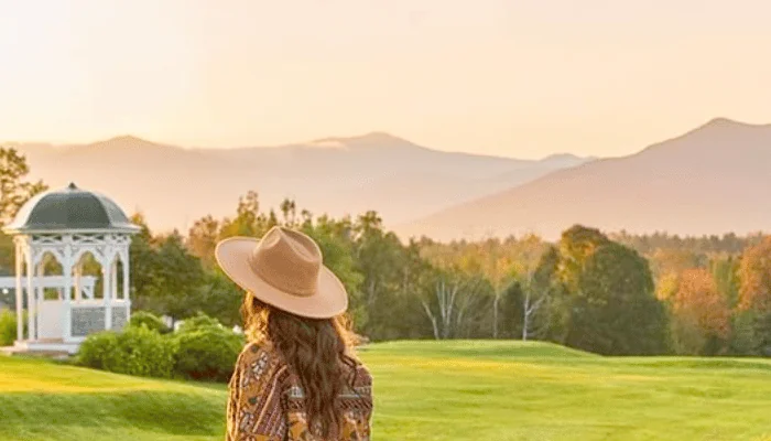 Woman with hat looking out over the grounds of the Mountain View Grand Resort and Spa