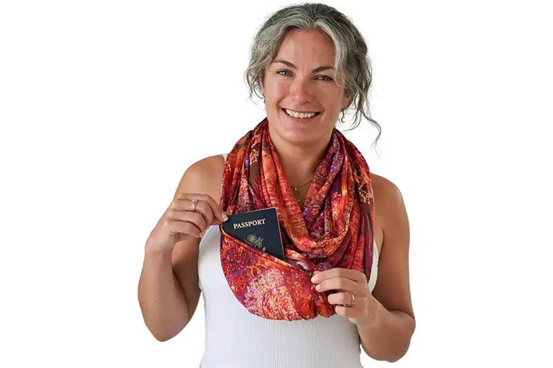 Woman showing off the functionality of the WAYPOINT GOODS Infinity Travel Scarf