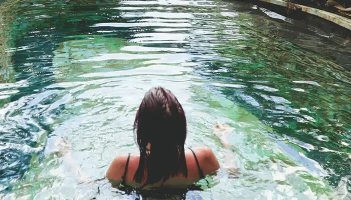 Woman soaking in hot springs