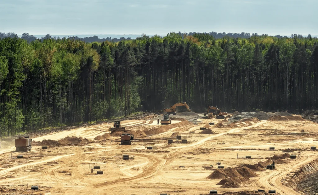 Human invasion of nature. Massive deforestation for construction. Destruction of ecology, bird nesting sites and wildlife habitats