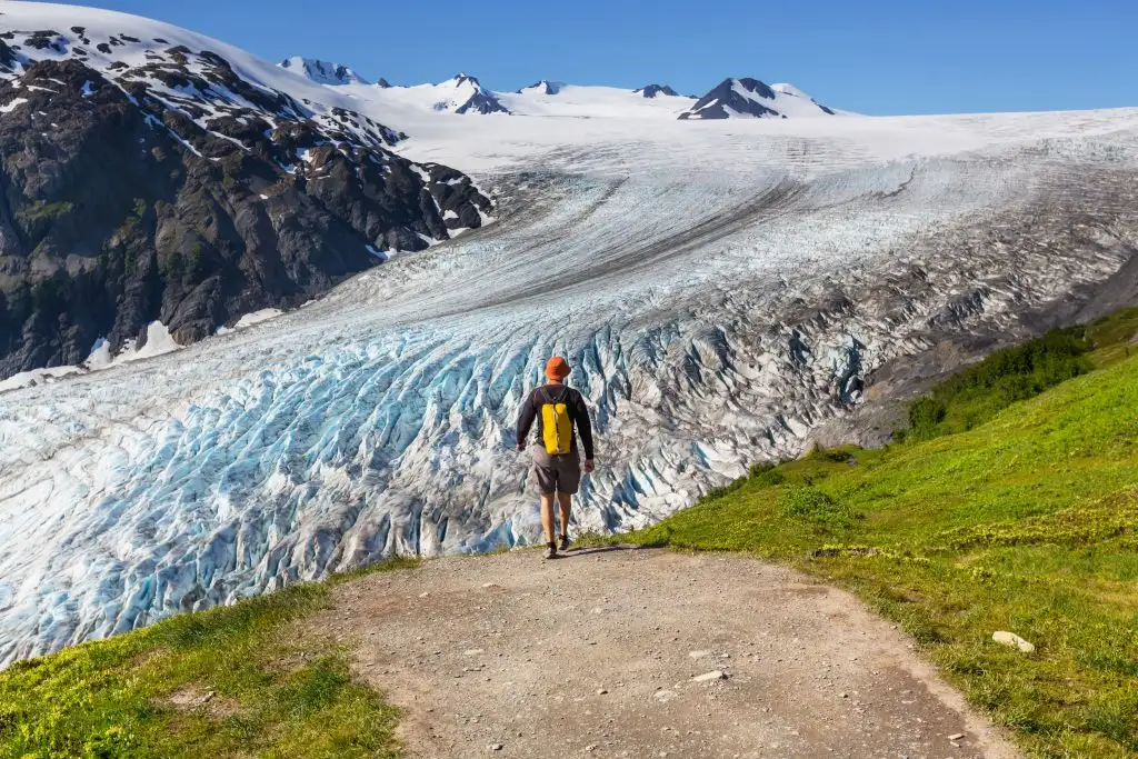 Kenai fjords national park - male walking along glacier