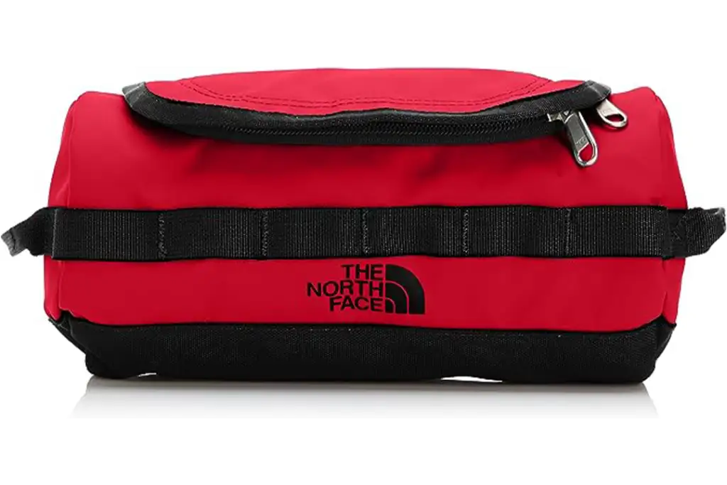 Red North Face Travel Canister on white background