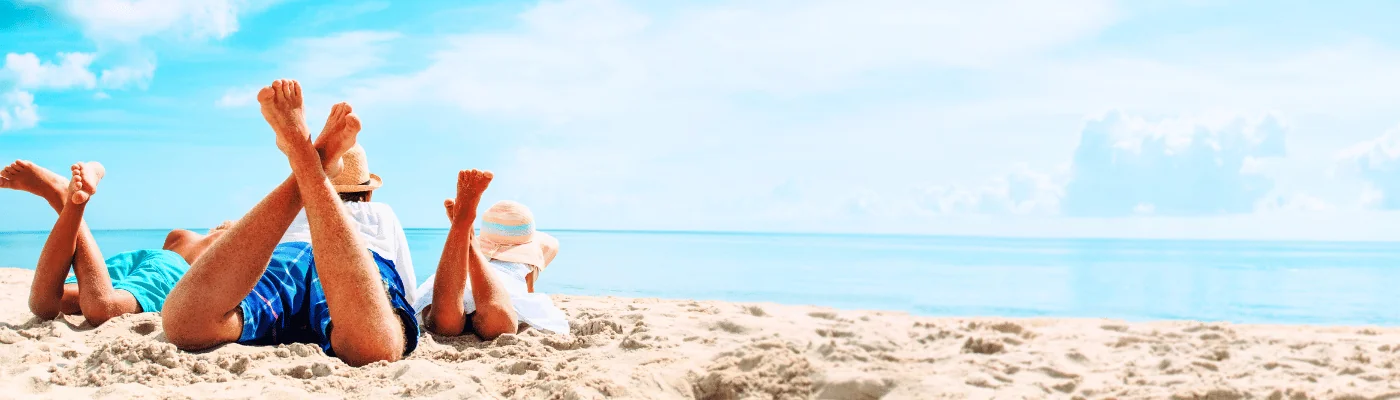 Father with son and daughter relax on beach vacation