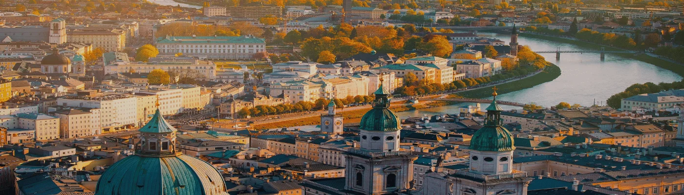 Panoramic view of Salzburg skyline historic city of Salzburg with Salzach river in beautiful golden evening light sky and colorful of autumn at sunset,Salzburger Land.