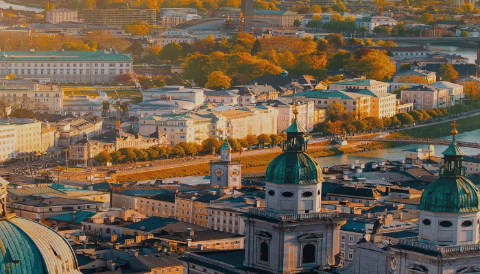 Panoramic view of Salzburg skyline historic city of Salzburg with Salzach river in beautiful golden evening light sky and colorful of autumn at sunset,Salzburger Land.