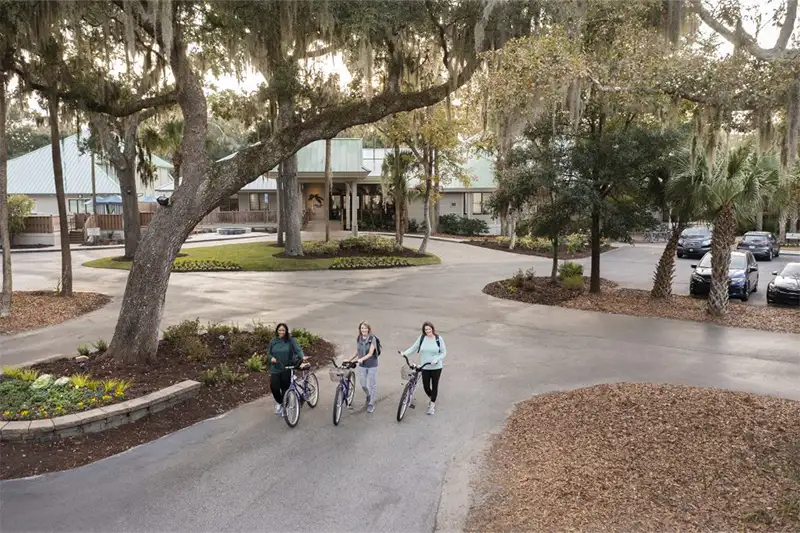 Three people riding bikes at ReNew Retreat, Hilton Head Health, South Carolina