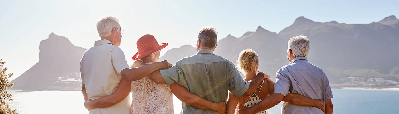 Group of senior travelers admiring a scenic view