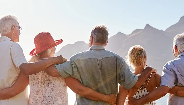 Group of senior travelers admiring a scenic view