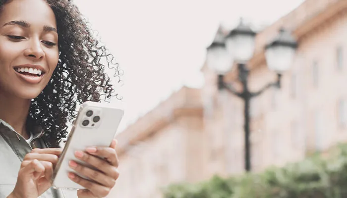 Woman using phone to navigate city