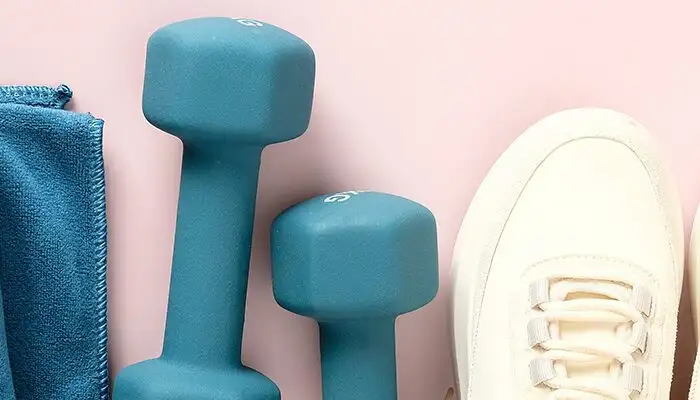 Fitness gear laid out on pink background