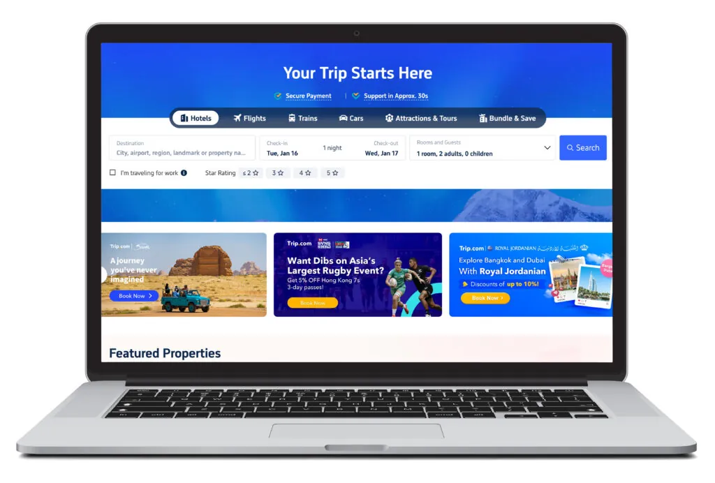 Open laptop showing homepage of Trip.com, a place where you can book last minute travel