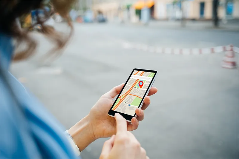 Woman using phone to navigate with offline GPS